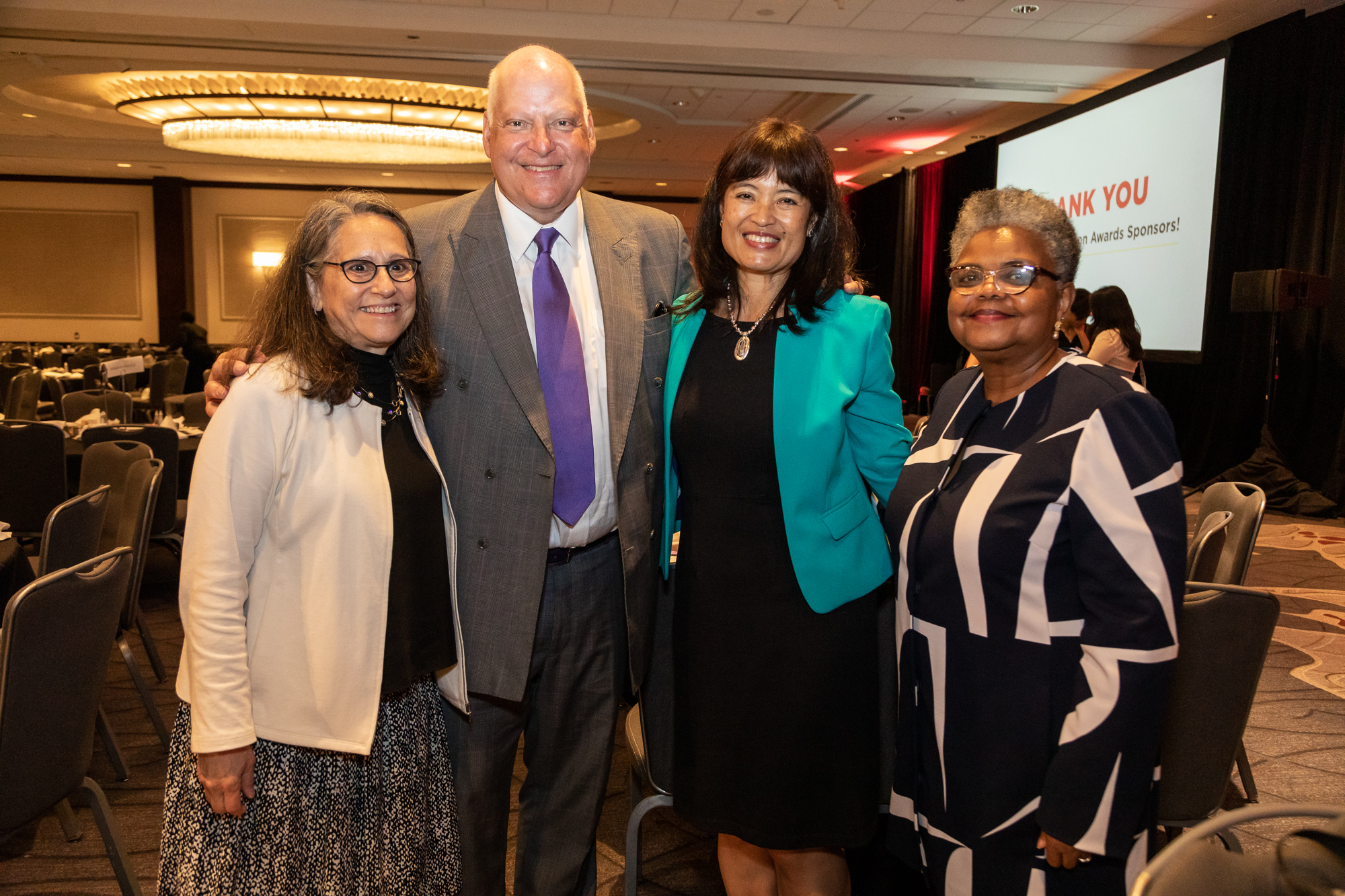 Photo from the 2023 Branton Luncheon picturing from left to right Board Co-Chair Jamie Gardner, Branton Awardee Lew Wiener, Executive Director Joanne Line, and Board Co-Chair Claudia Withers